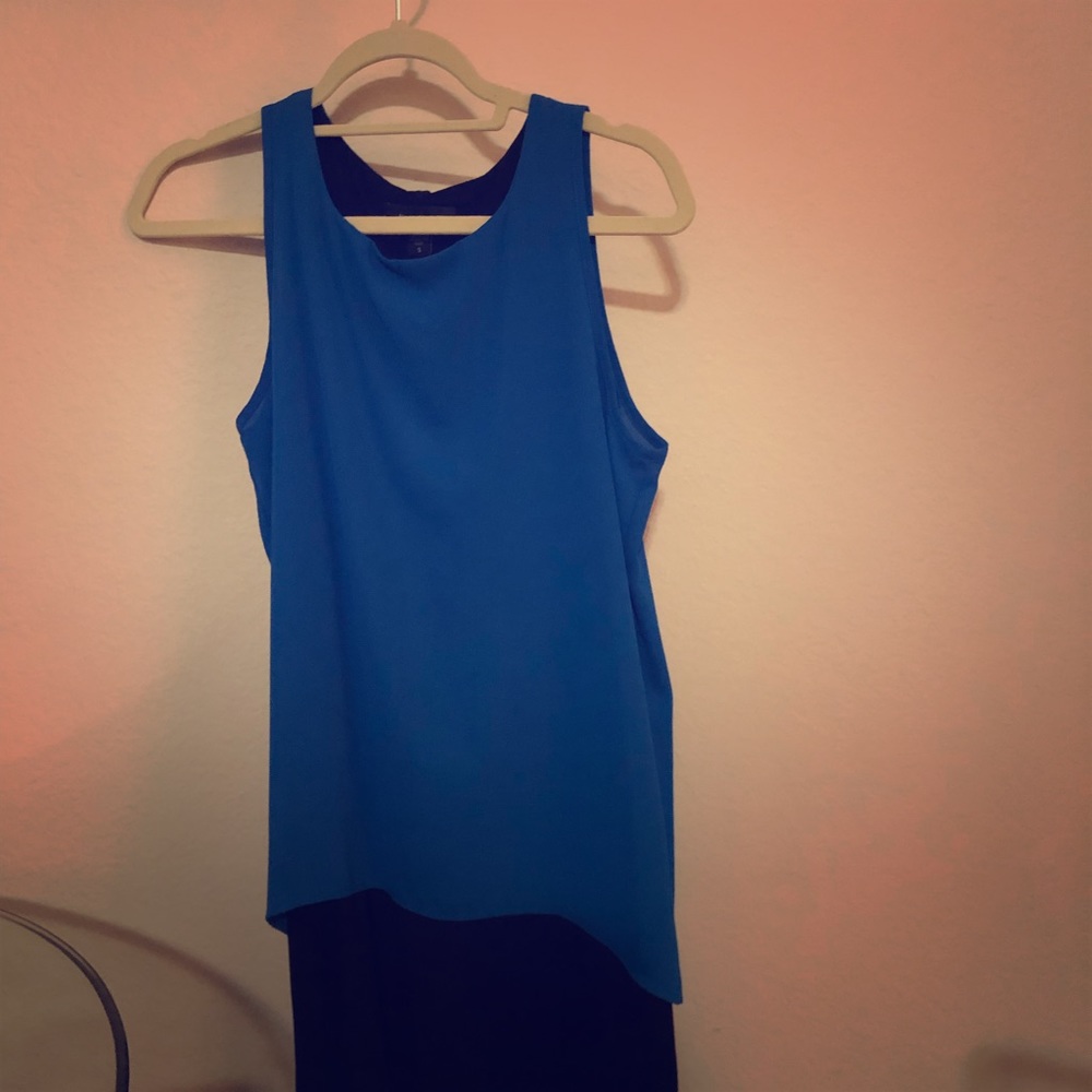 Blue chiffon layer over classic black tank dress.